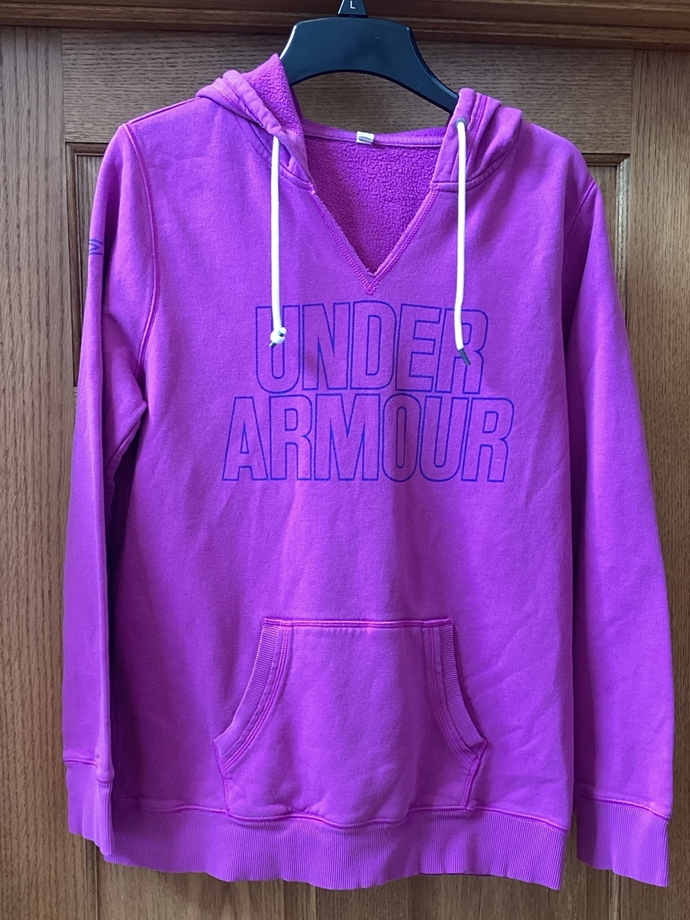 Under Armour purplish pink v-neck hoodie. Women’s size large good condition